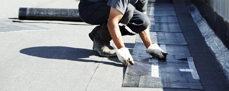 man preparing to install commercial roofing