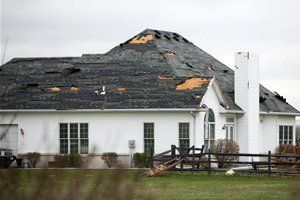storm damaged roof and shingles.