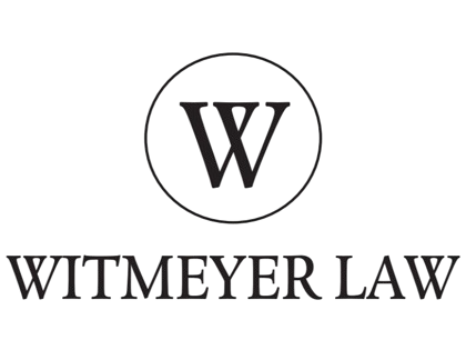 A black and white logo for witmeyer law with a letter w in a circle.