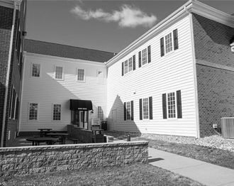 A black and white photo of a large white building