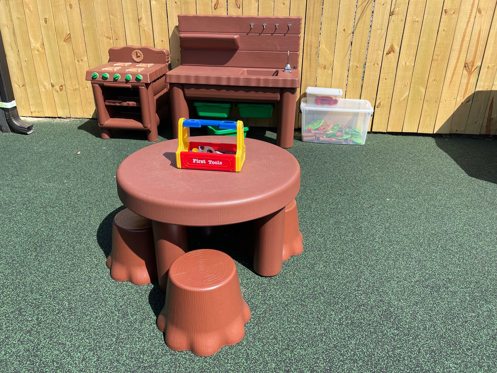 a table and stools in the shape of a tree stump .