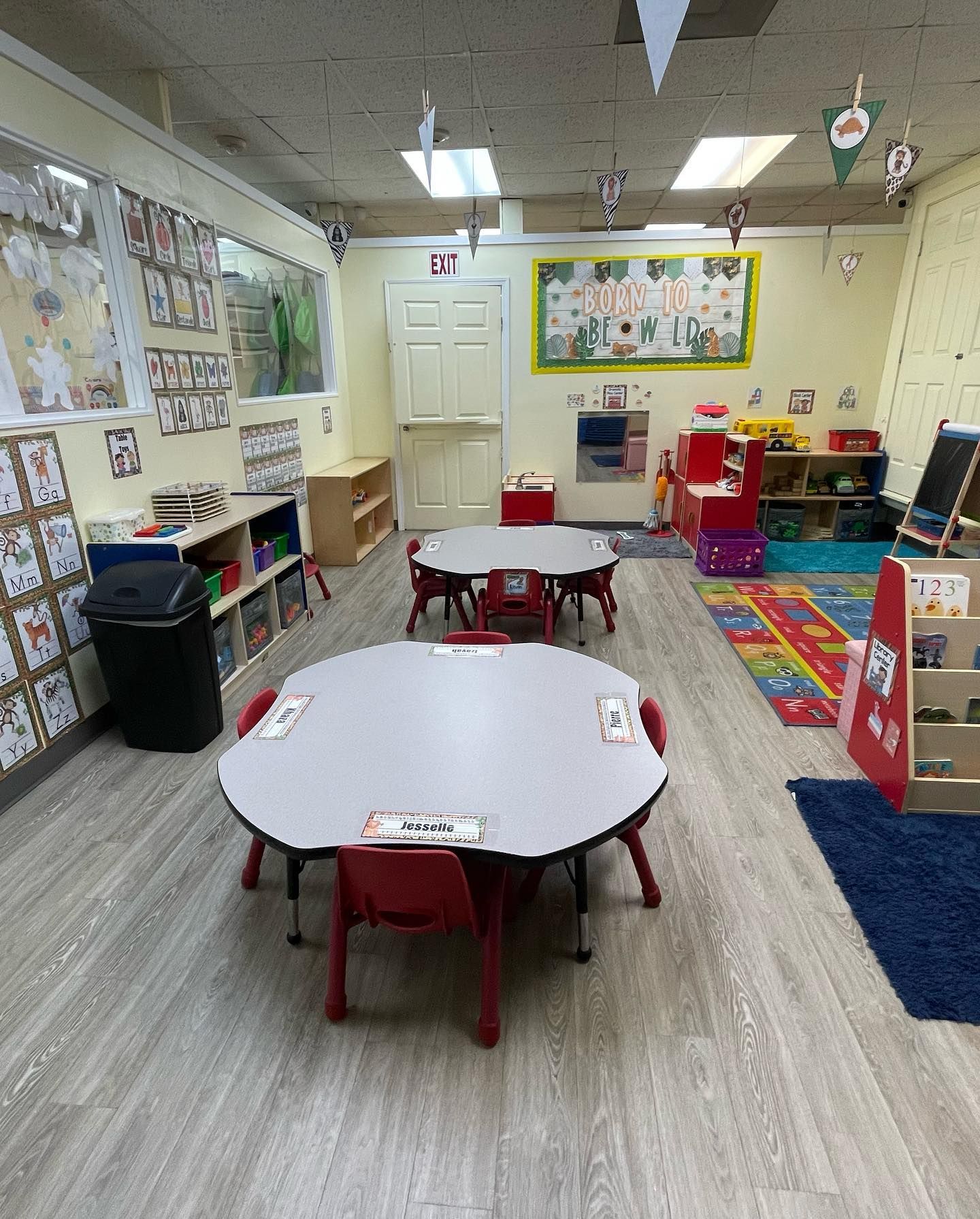 a classroom with tables and chairs in it