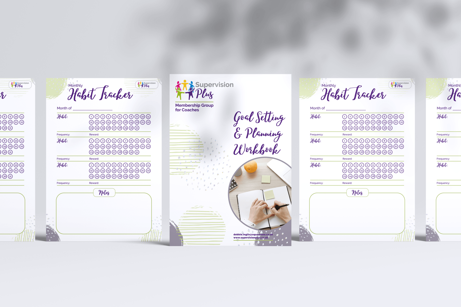 A group of papers sitting on top of each other on a table.