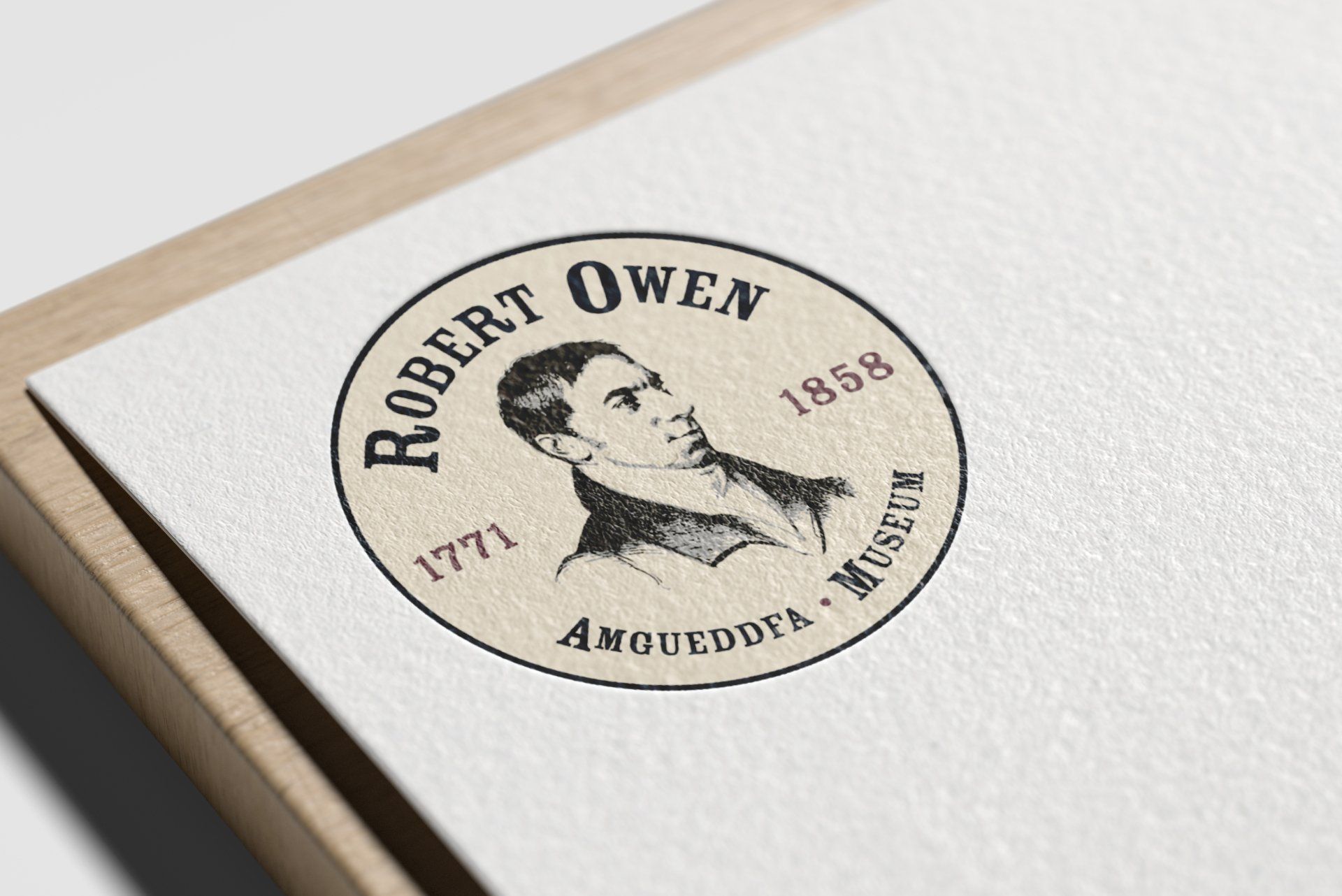 A robert owen logo is on a piece of paper