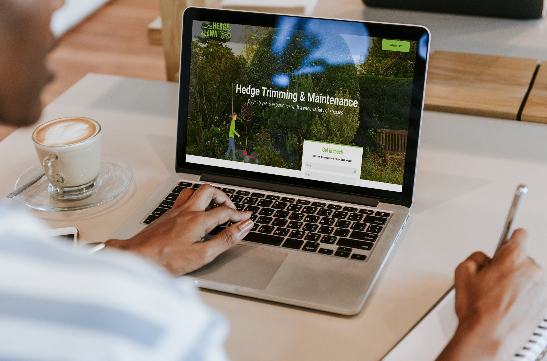 A person is sitting at a desk using a laptop computer.