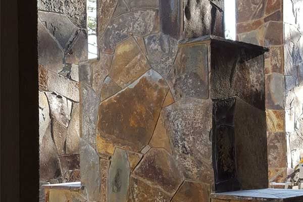 Stone wall with a chimney