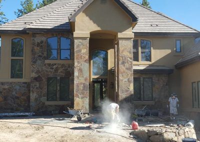 A large house with a lot of windows is being built