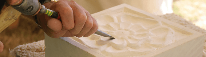 A Tudor rose pattern being carved in stone