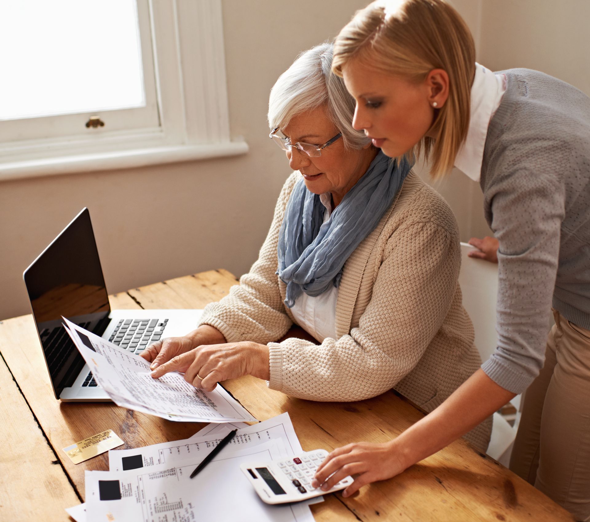 Two women going over documentation