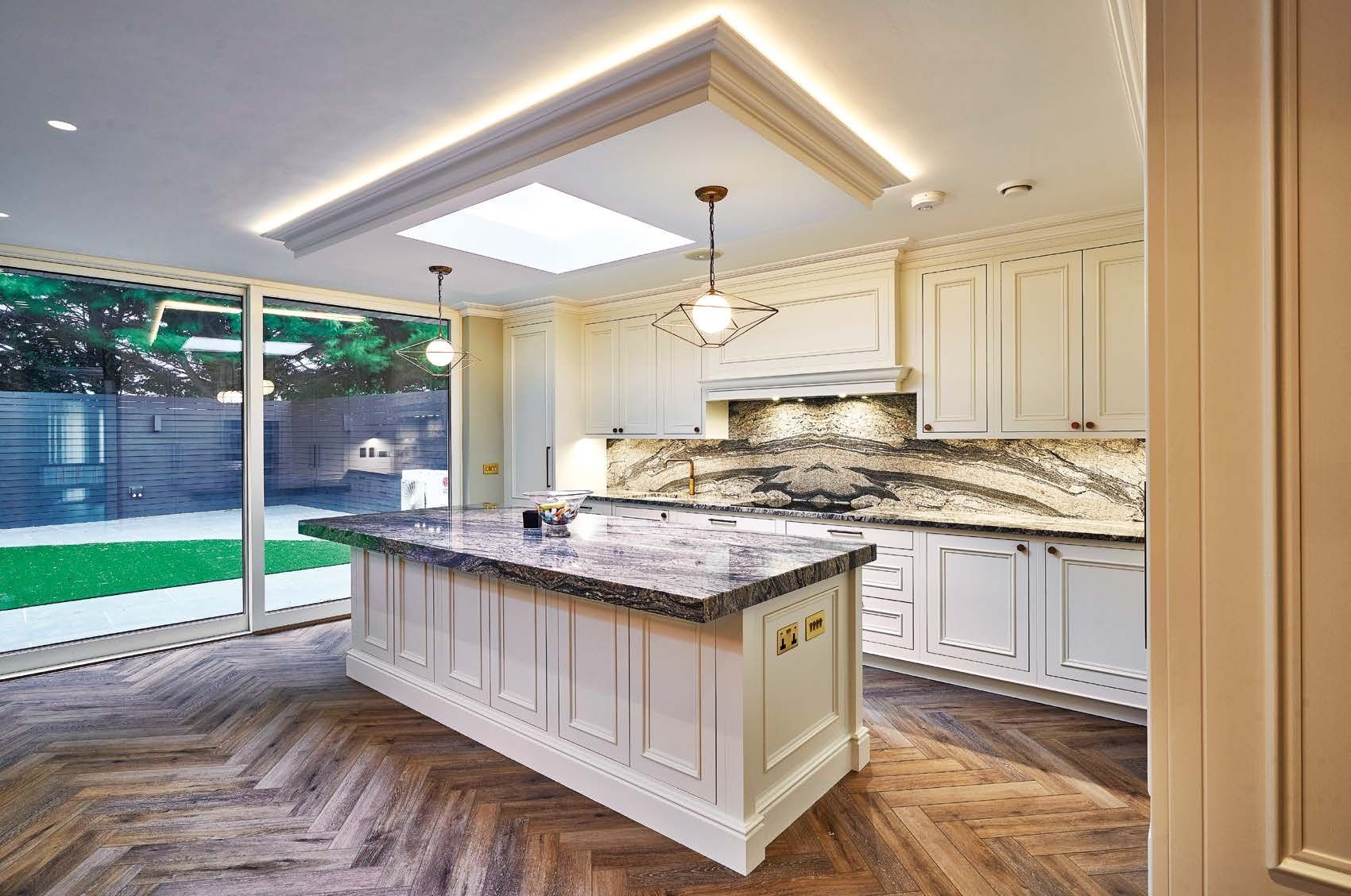 There is a large island in the middle of the kitchen.