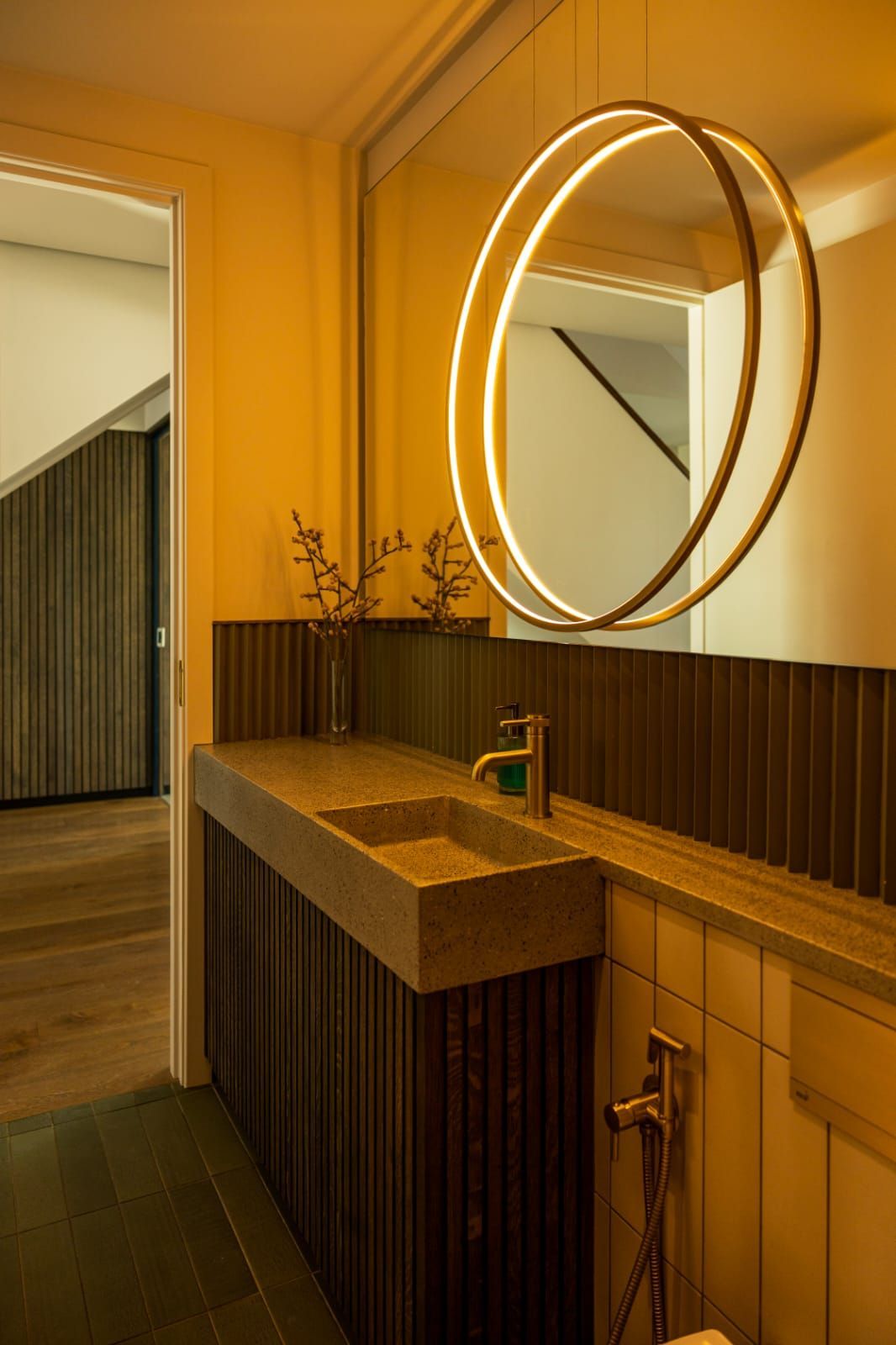 A bathroom with a sink and a large mirror
