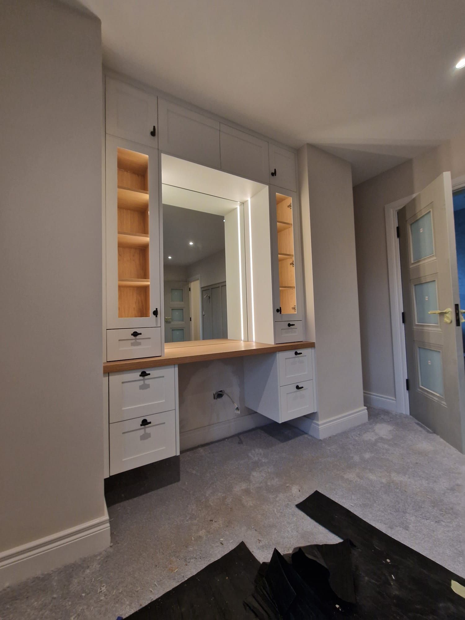 There is a large mirror in the middle of the room.