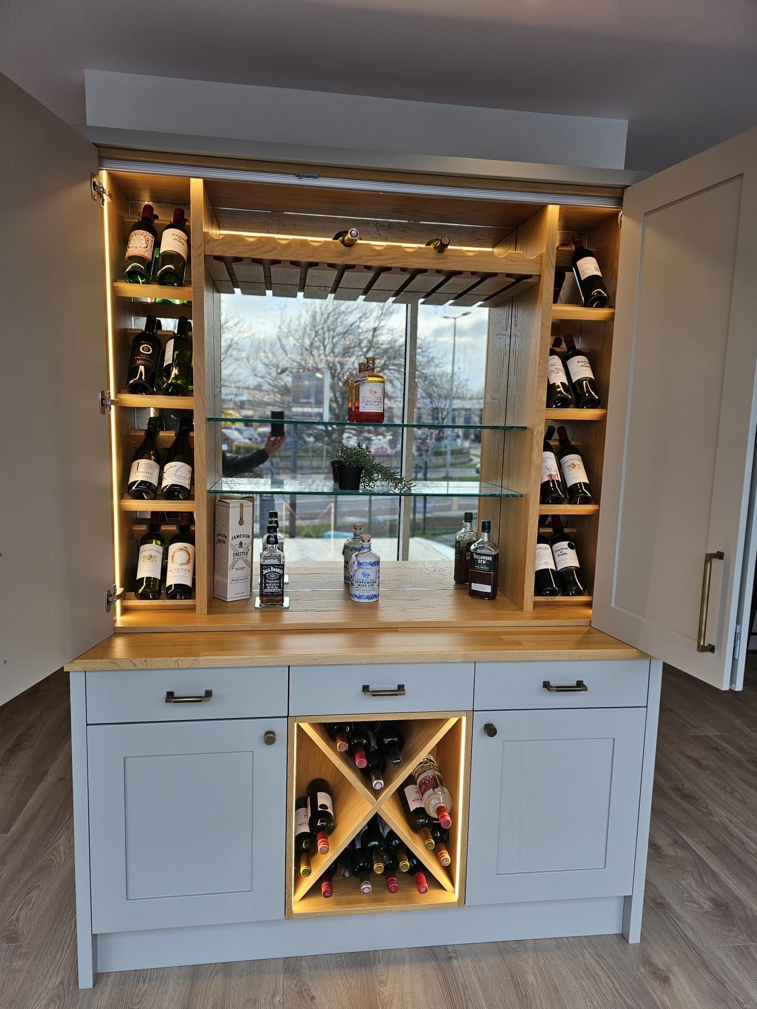 A wine rack filled with bottles of wine in a living room.