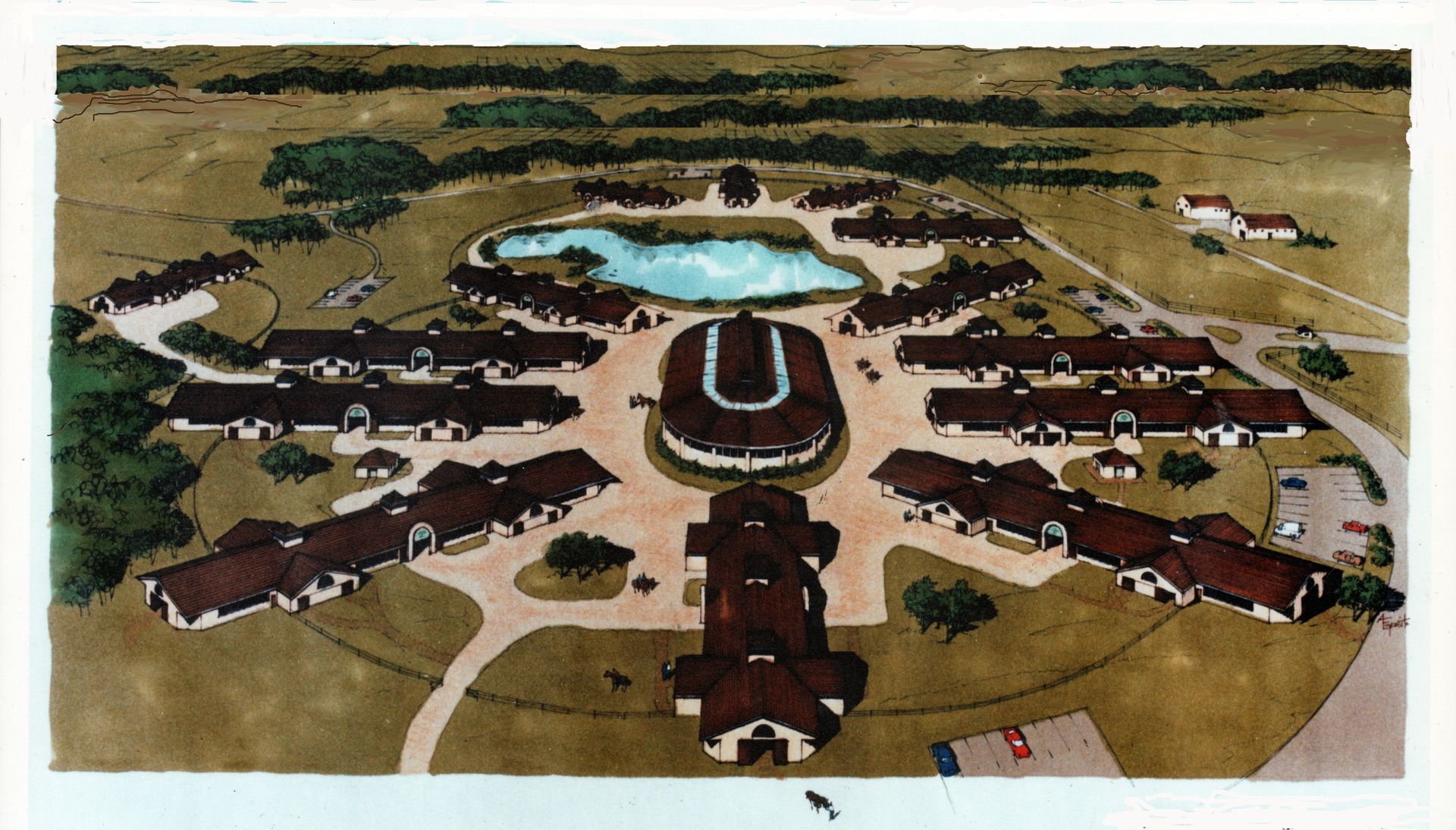 Aerial view of a circular residential complex with a pond and multiple buildings connected by walkways.