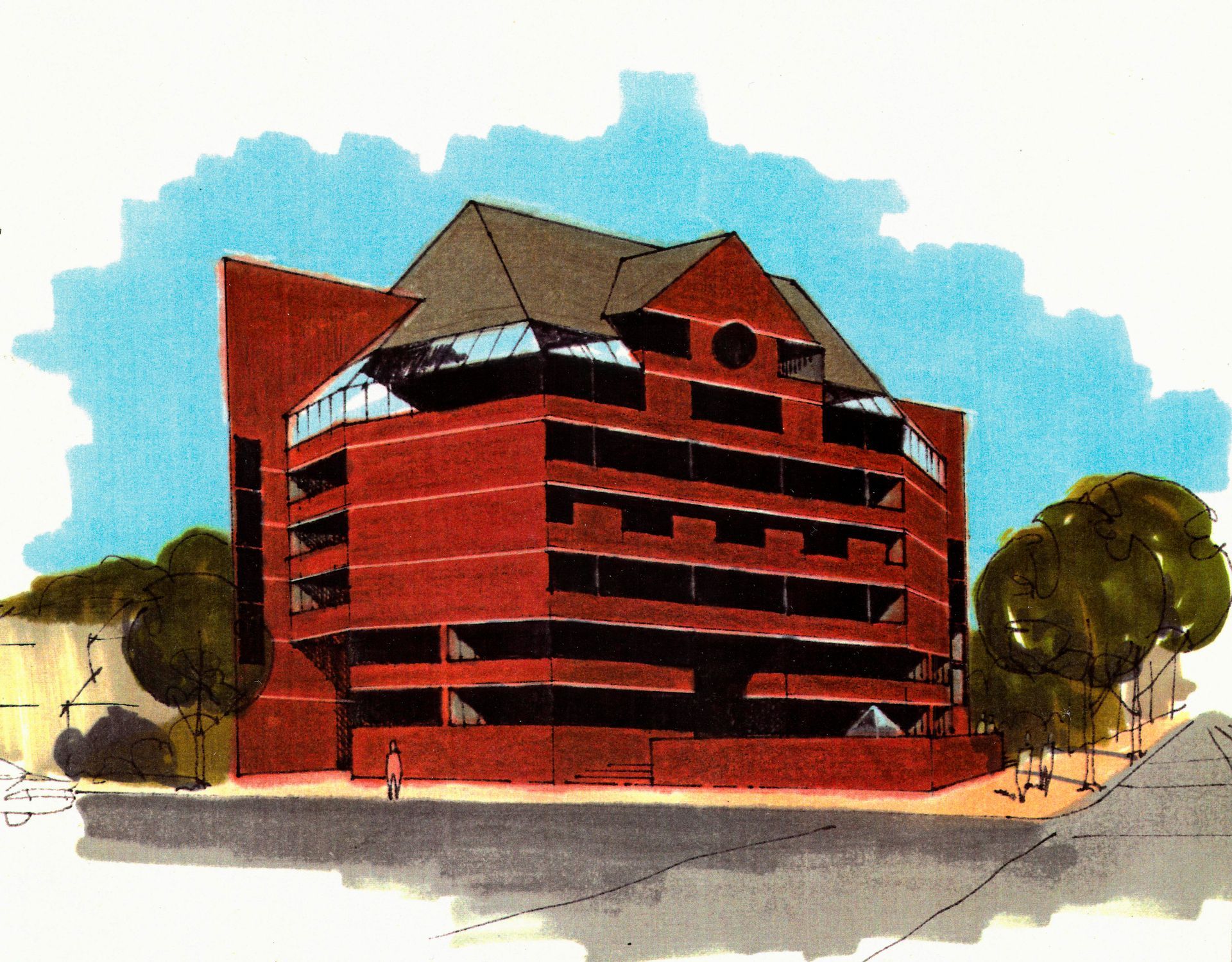Red brick multi-story building with a sloping roof and a glass-enclosed section; trees and a sidewalk in the foreground.