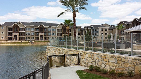 A Large Building with A Lake in Front of It
