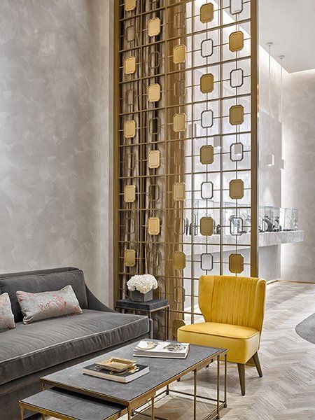 A Living Room with A Couch, Chair, Coffee Table, and Screen