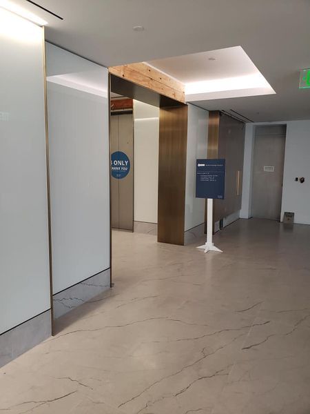 A Hallway with A Sign that Says Open on It