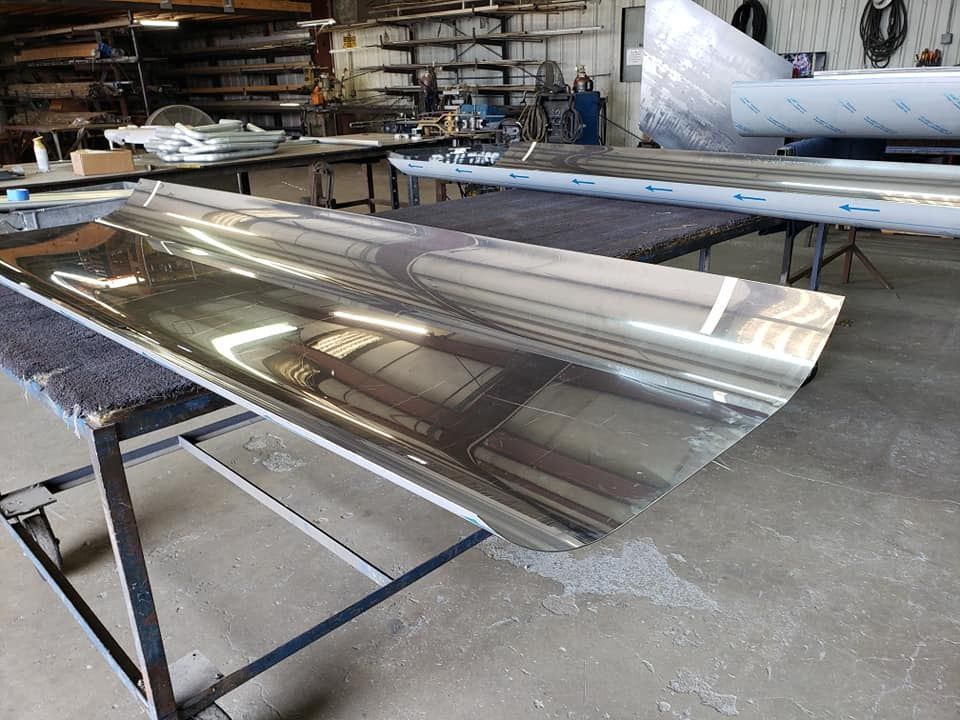 A Large Piece of Metal Is Sitting on Top of A Table in A Factory