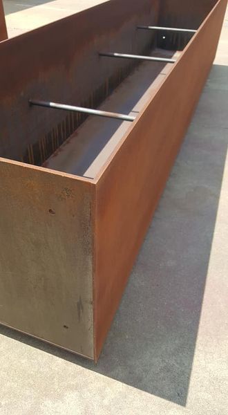 A Large Wooden Box Is Sitting on Top of A Concrete Floor