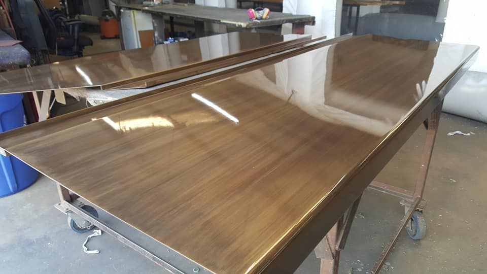 A Wooden Table Is Sitting on Top of A Cart in A Room