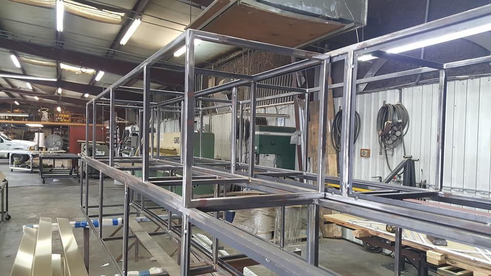 A Large Metal Structure Is Being Built in A Factory