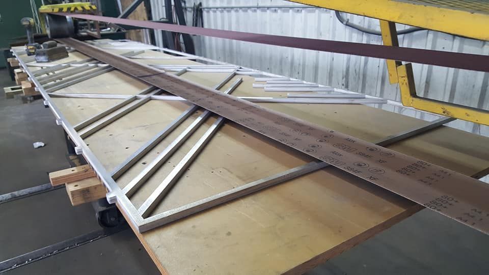 A Large Piece of Metal Is Sitting on Top of A Wooden Table