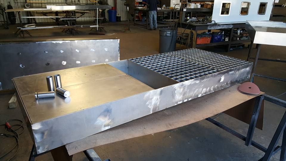 A Piece of Metal Is Sitting on Top of A Wooden Table