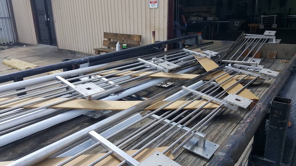 A Bunch of Metal Pipes Are Sitting on Top of A Wooden Table