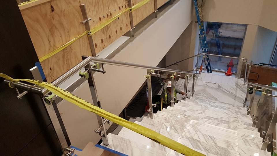 A Staircase Is Being Built in A Building with A Yellow Tape Around It