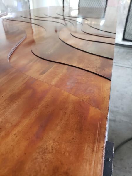 A Wooden Floor with A Curved Design on It