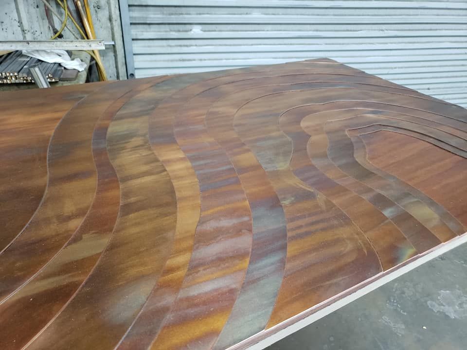 A Wooden Table with A Swirl Pattern on It