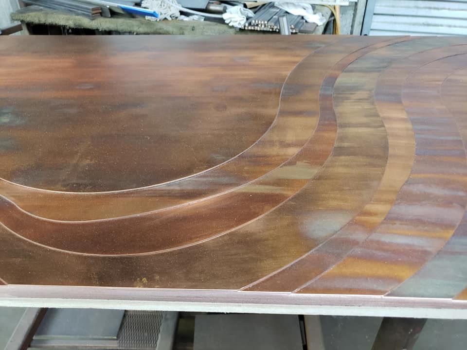 A Wooden Table with A Circular Design on It