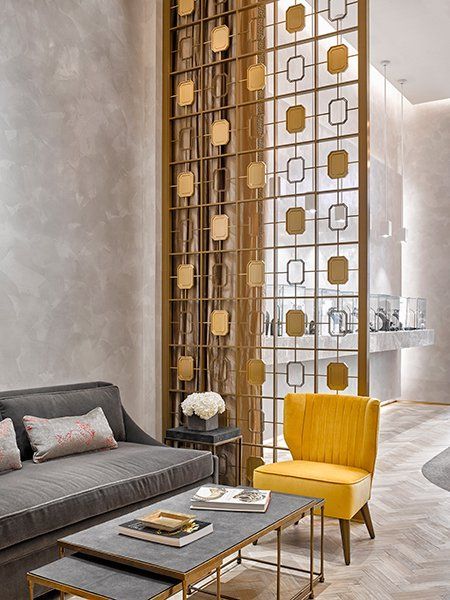 A Living Room with A Couch, Chair, Coffee Table and Screen