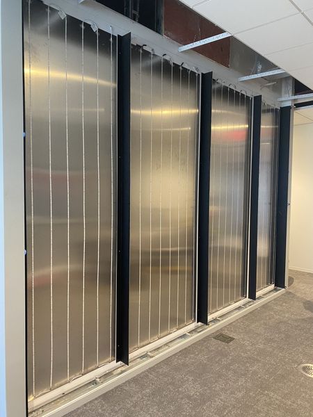 A Hallway with A Row of Stainless Steel Walls