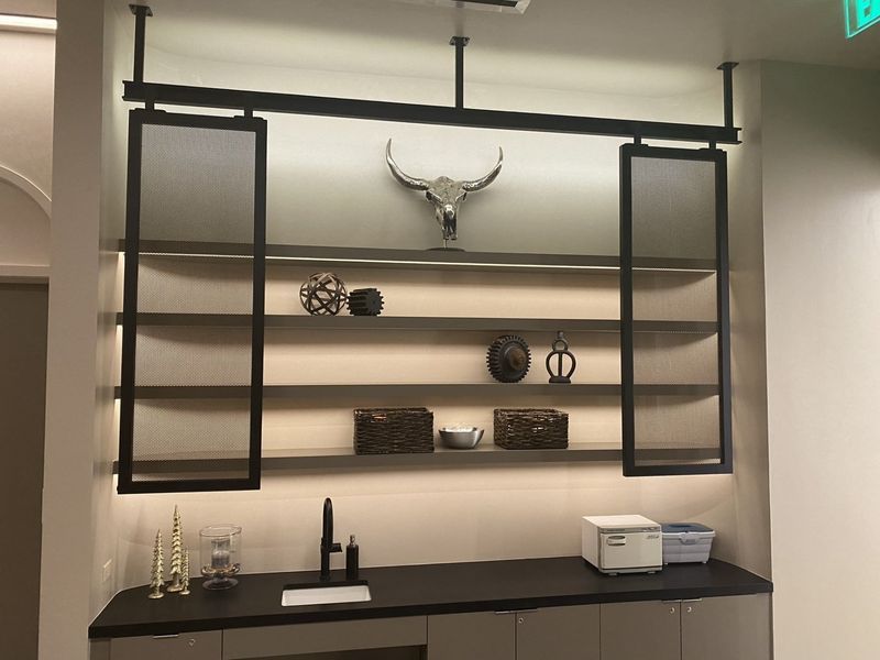 A Kitchen with Shelves and A Skull on The Wall