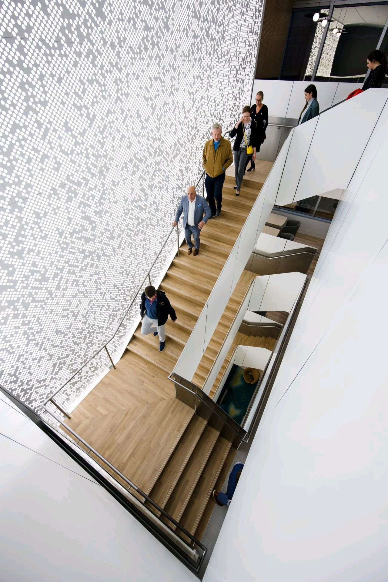 A Staircase in A Building with A Sign on The Wall