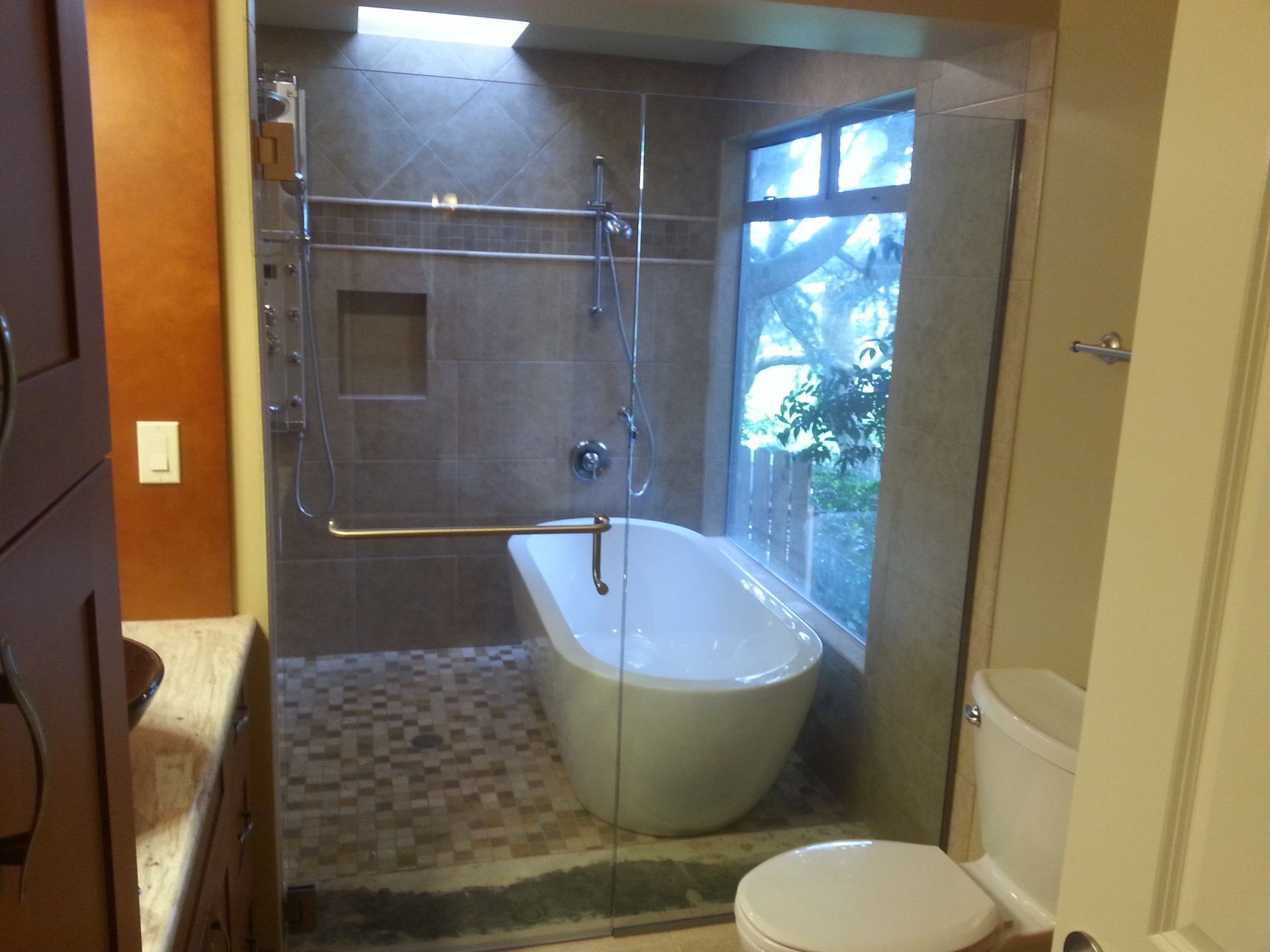 A bathroom with a bathtub and a toilet