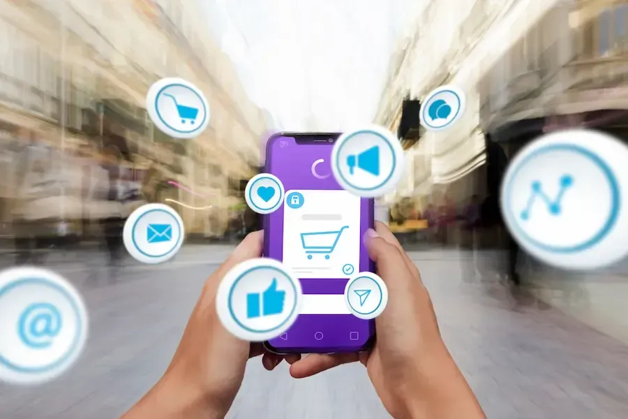 Person e-commerce shopping on cell phone with social media.
