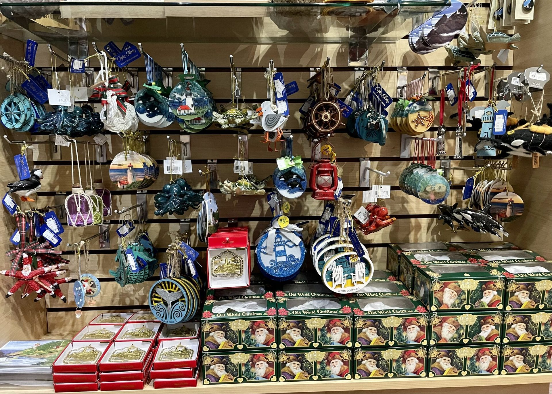 A display case filled with lots of christmas ornaments and boxes.