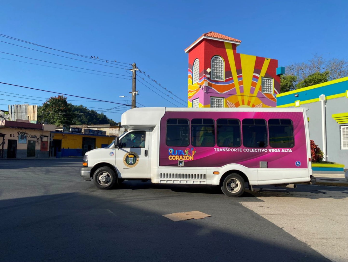 Passenger loading his bicycle on the front of bus