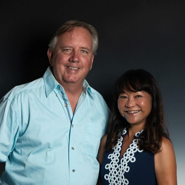 A man and a woman are posing for a picture together