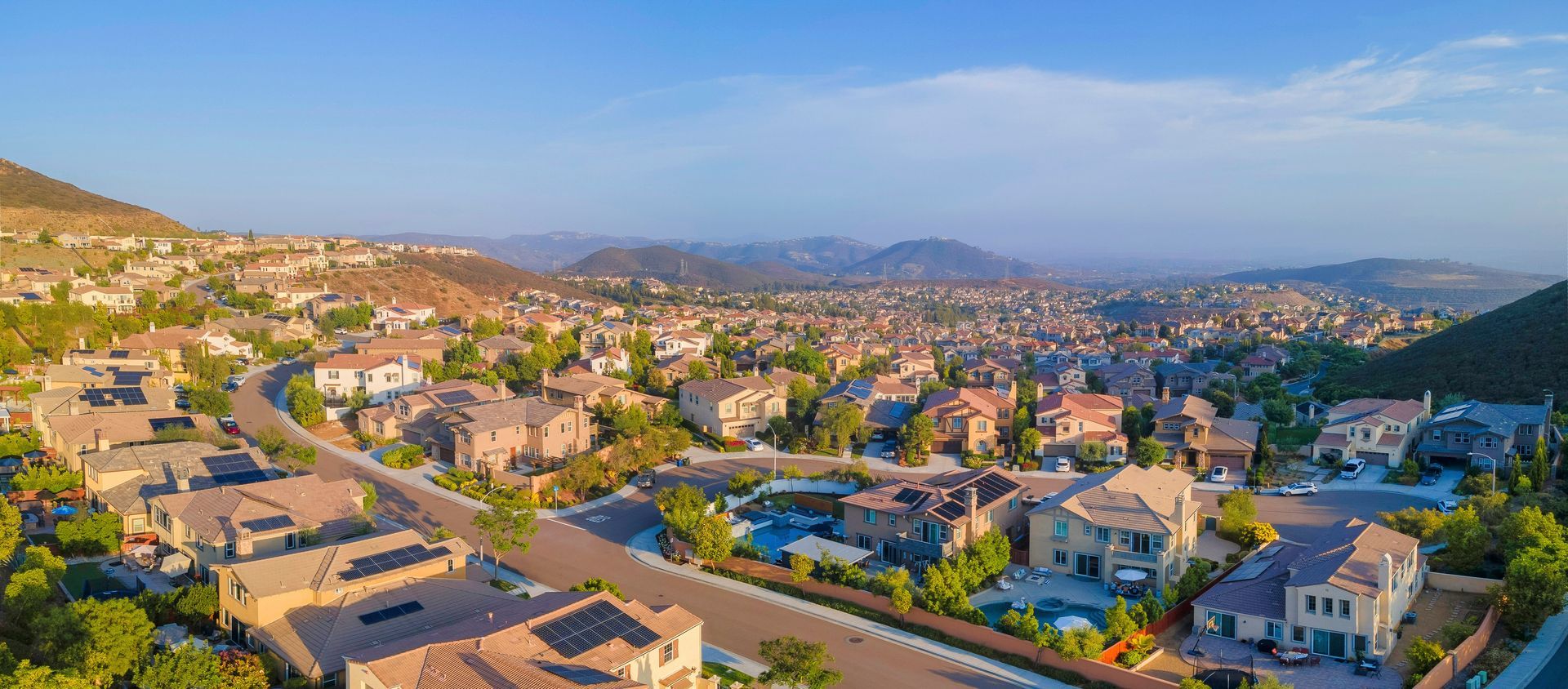 An aerial view of a residential area with lots of houses and trees.
