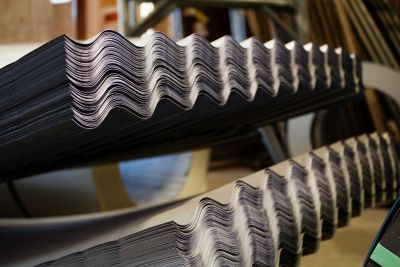 A close up of a stack of corrugated metal sheets