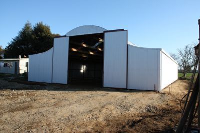 A large white building with the doors open