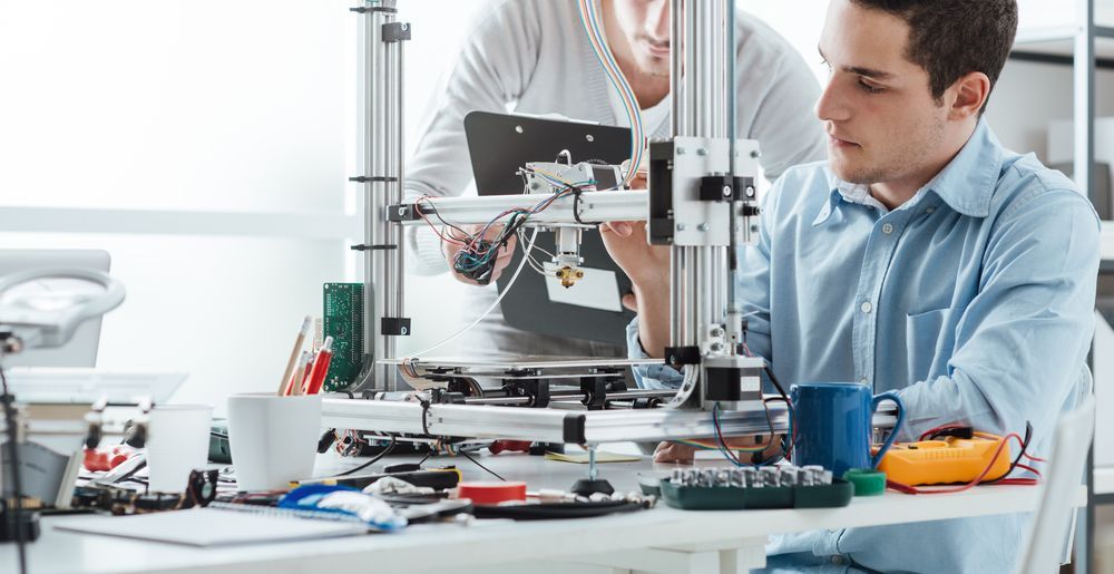 Two Men Are Working on a 3d Printer in a Lab — Lismore Computer Solutions in Ballina, NSW