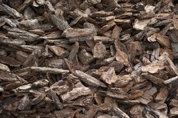 A pile of wood chips sitting on top of each other on a table.