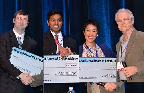 NDBA Board of Directors A group of men and women are posing for a picture in a hallway.