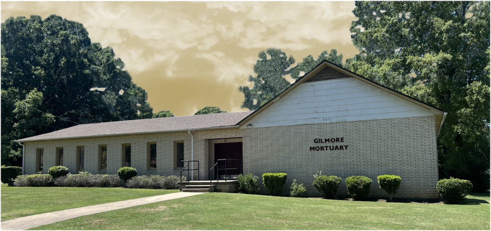 A large office building with a lot of windows on a sunny day.