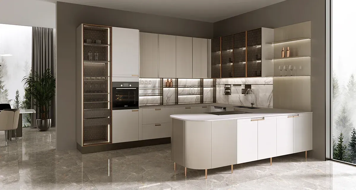 A kitchen with white cabinets and a large island in the middle of the room.